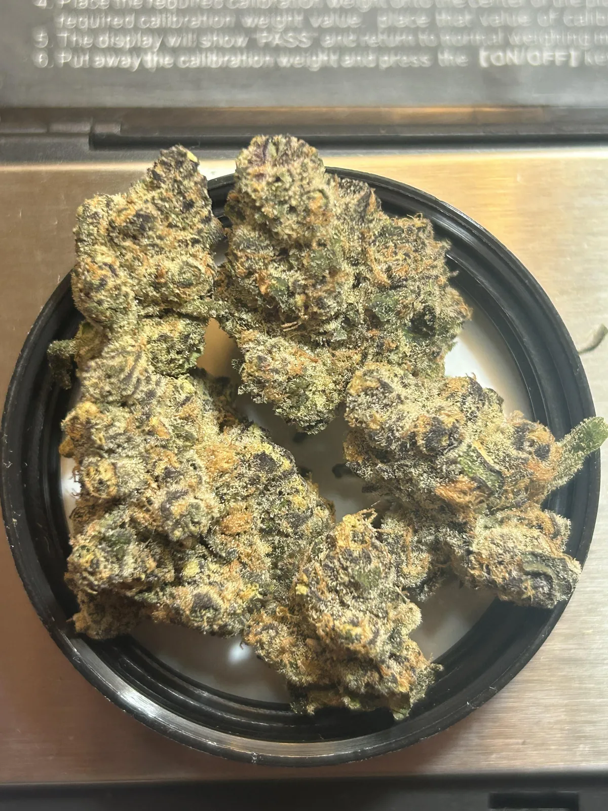 Potent cannabis buds with rich trichomes and orange hairs, ready for a social club in Aguilas, Spain.