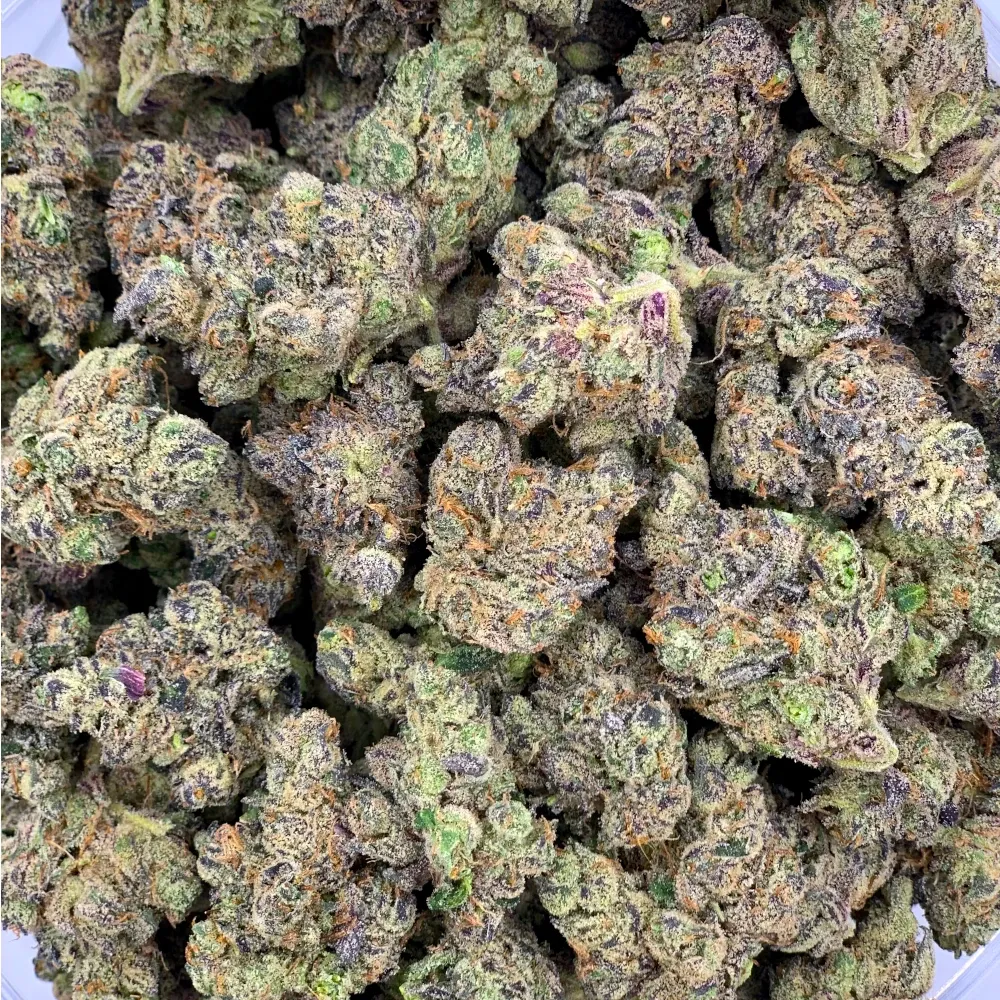 Close-up of vibrant green, purple, and orange cannabis buds for social clubs in Huercal Overa, Spain.